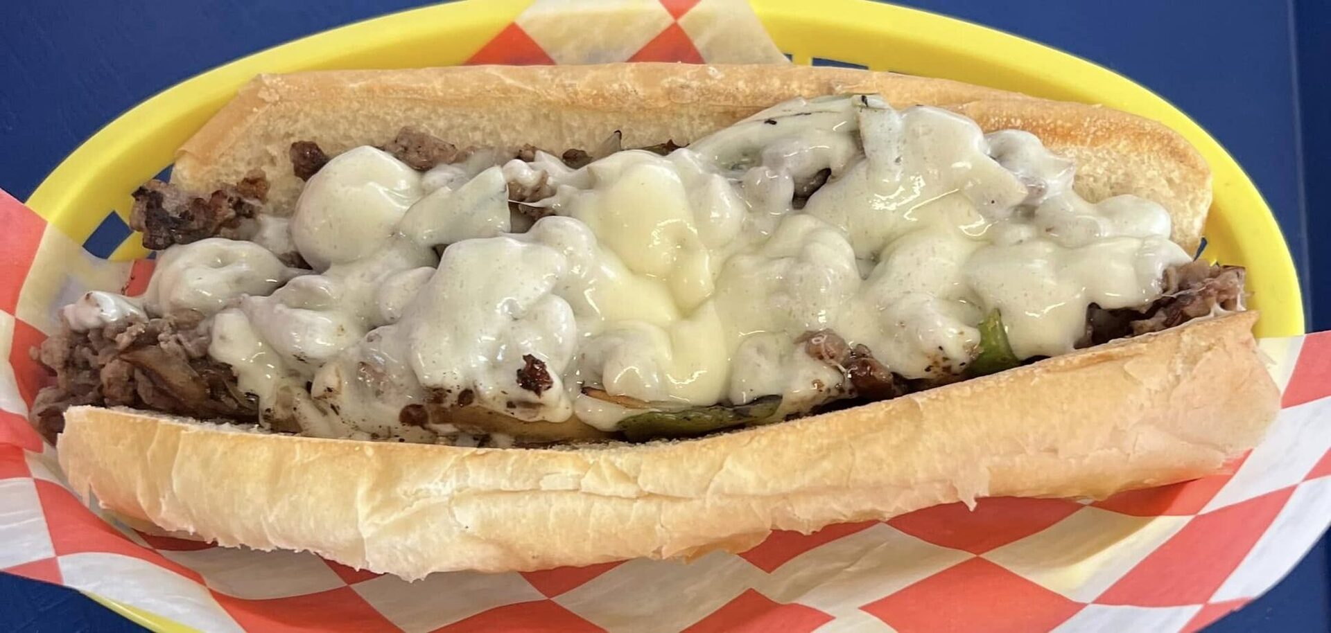 Steak and cheese sub with melted provolone