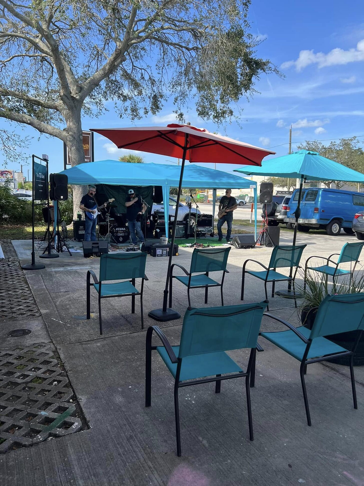 Live music on the patio under umbrellas