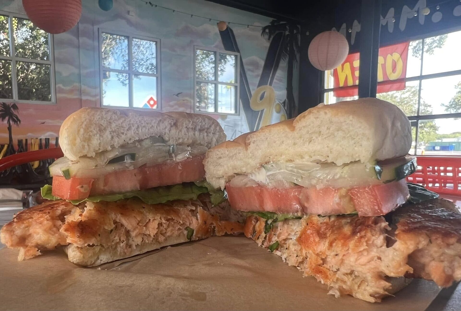 Salmon sandwich in the dining room with paper lanterns