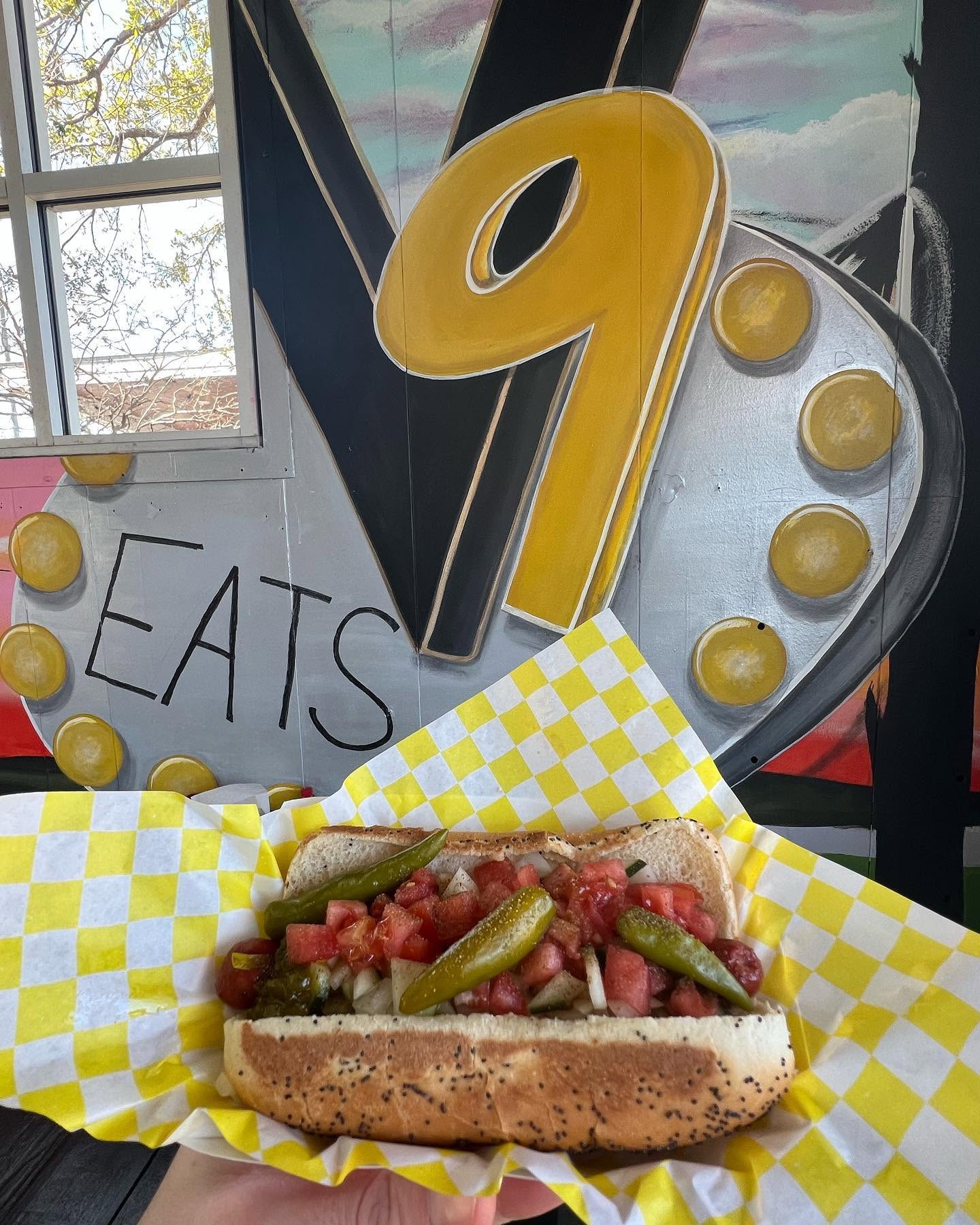 The Chicago Dog with tomato, sport peppers and pickle